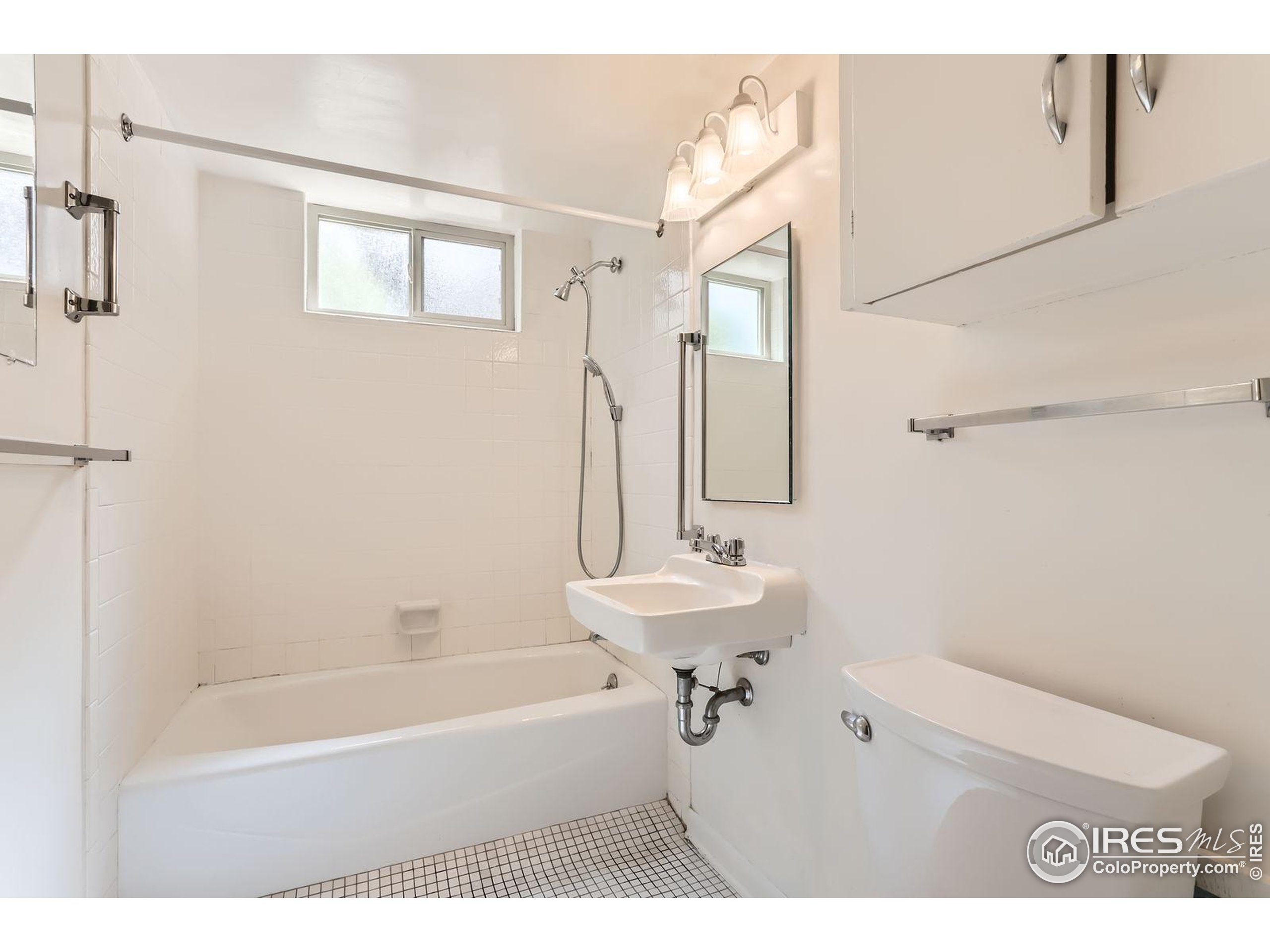 360 20th Street Boulder, CO 80302 - Photo 23 of 31 a bathroom with a sink a toilet and shower
