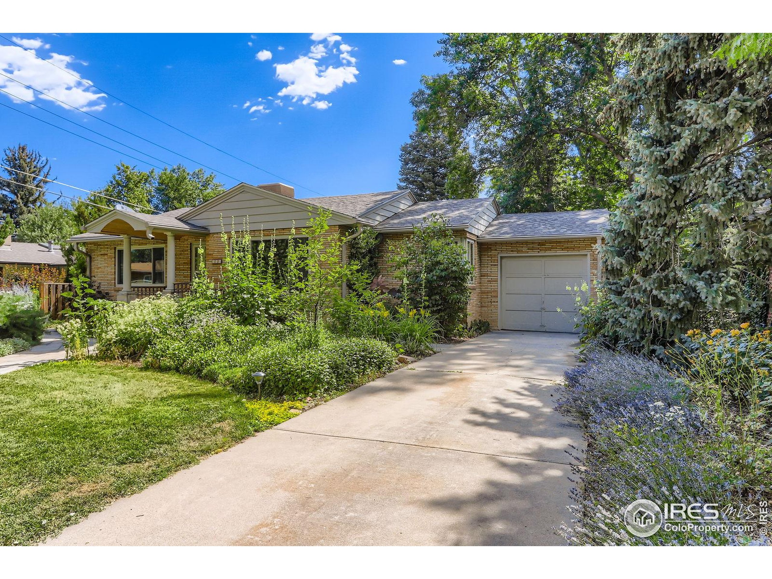 360 20th Street Boulder, CO 80302 - Photo 29 of 31 a front view of a house with a yard