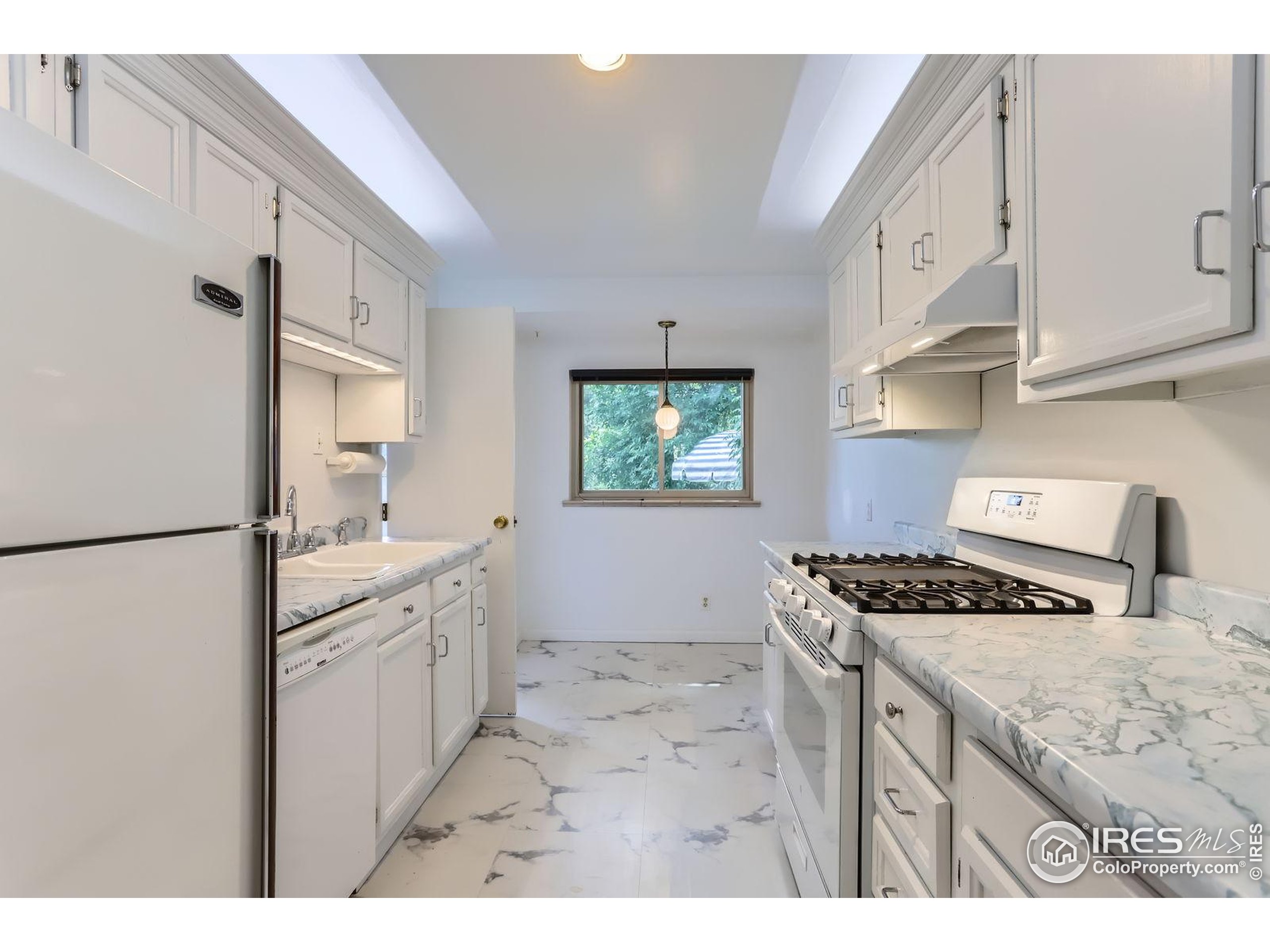360 20th Street Boulder, CO 80302 - Photo 9 of 31 a kitchen with stainless steel appliances granite countertop a stove a sink and a refrigerator