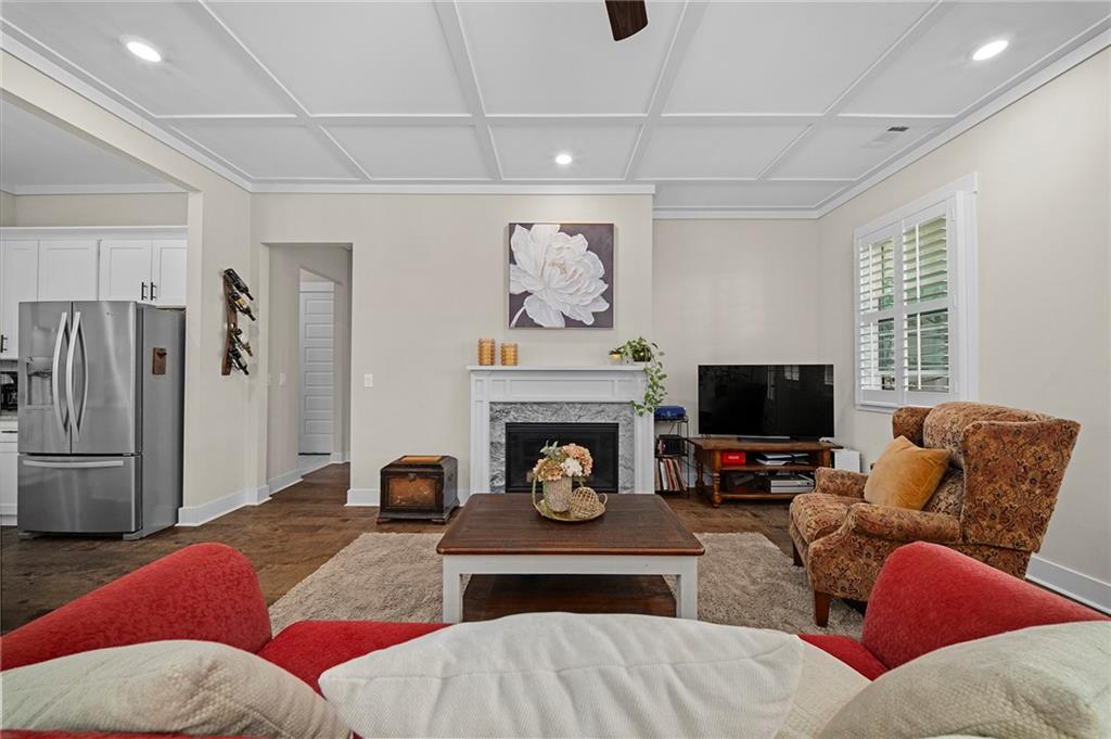 392 London Road Ball Ground, GA 30107 - Photo 9 of 53 a living room with furniture and a fireplace