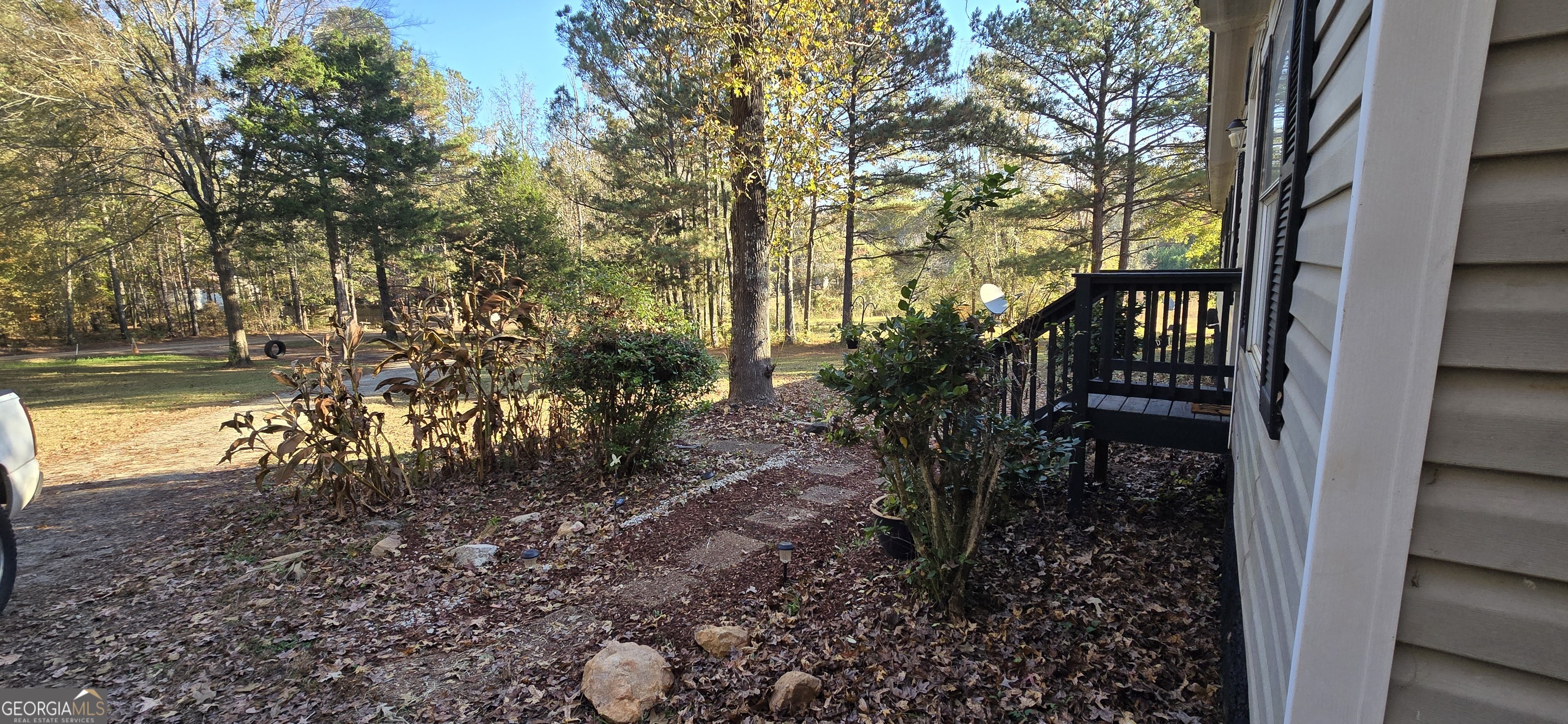 352 Jeffrey Way Forsyth, GA 31029 - Photo 2 of 12 a view of a yard with plants and large trees