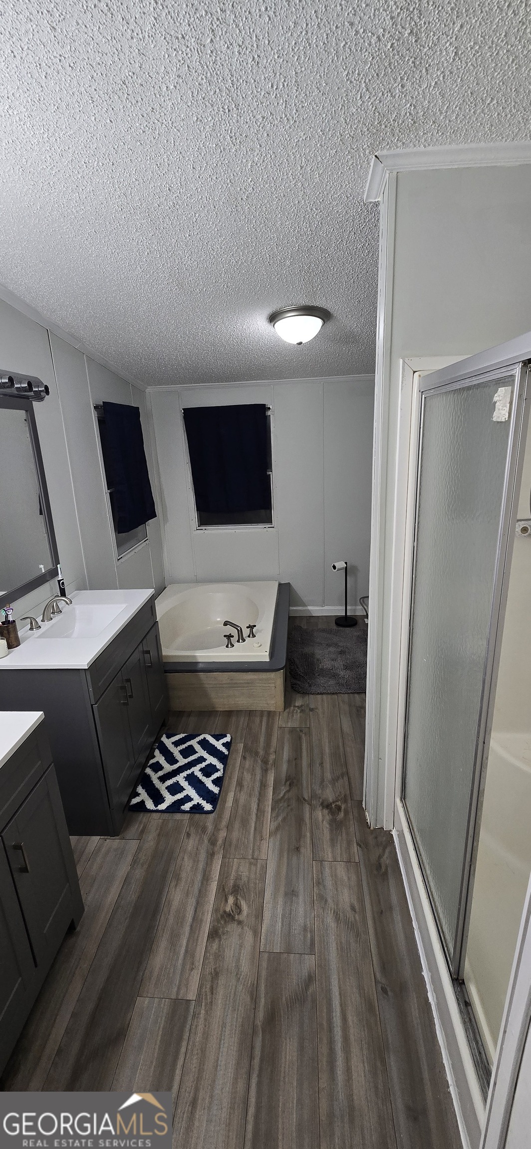 352 Jeffrey Way Forsyth, GA 31029 - Photo 9 of 12 a living room with furniture and a flat screen tv