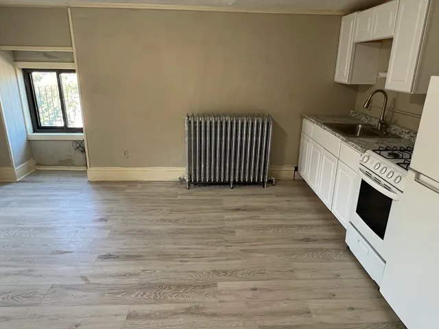 a view of a kitchen from an empty room