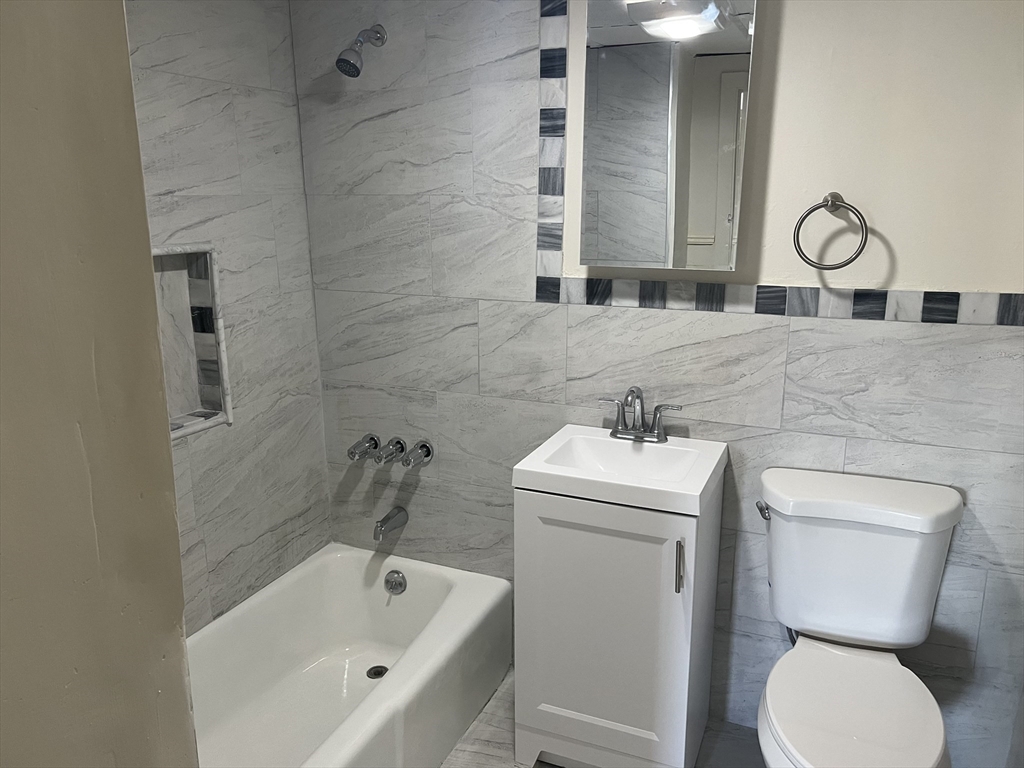 14 Monument Square, Unit 411 Boston, MA 02129 - Photo 7 of 7 a bathroom with a sink and a toilet