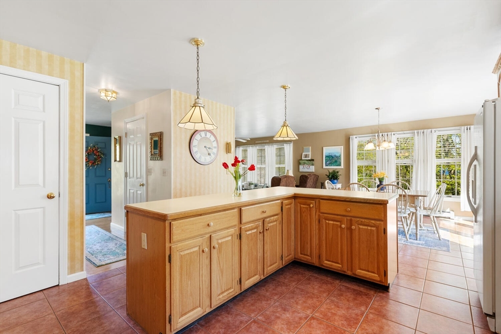 8 Oxford Road Gloucester, MA 01930 - Photo 13 of 35 a large kitchen with stainless steel appliances granite countertop a stove a sink dishwasher and a refrigerator with wooden floor