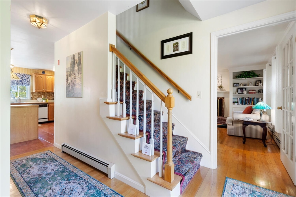 8 Oxford Road Gloucester, MA 01930 - Photo 22 of 35 a living room with fireplace furniture and a wooden floor
