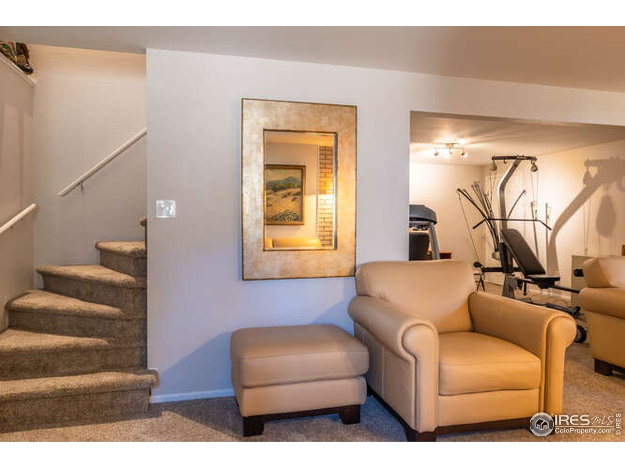 8829 Marathon Road Niwot, CO 80503 - Photo 16 of 33 Down the stairs we go to a great flex space/rec room