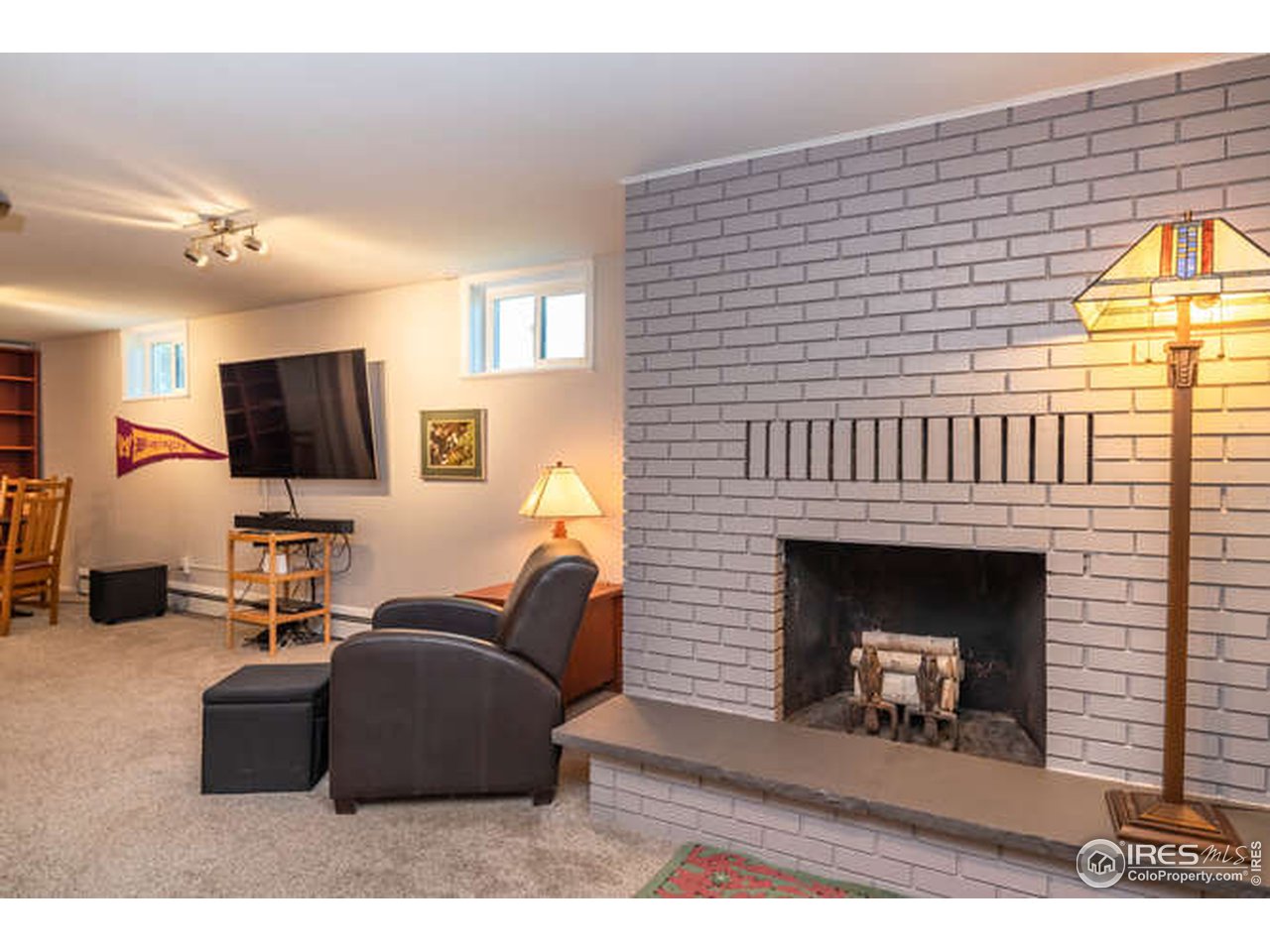 8829 Marathon Road Niwot, CO 80503 - Photo 19 of 33 Wood burning fireplace in the family room