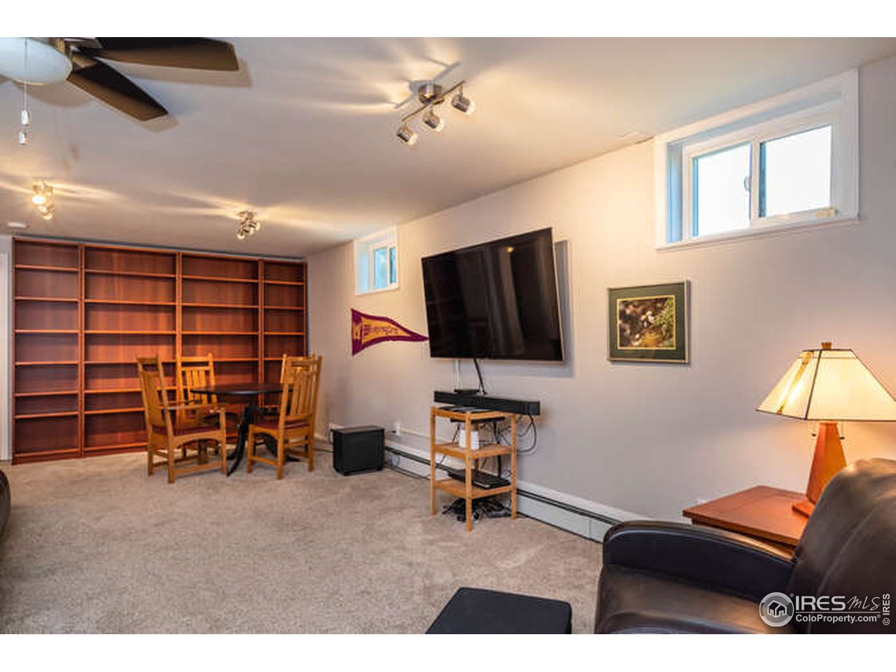 8829 Marathon Road Niwot, CO 80503 - Photo 20 of 33 This family room is so large it can be used for so many things! (cherry shelving units excluded)