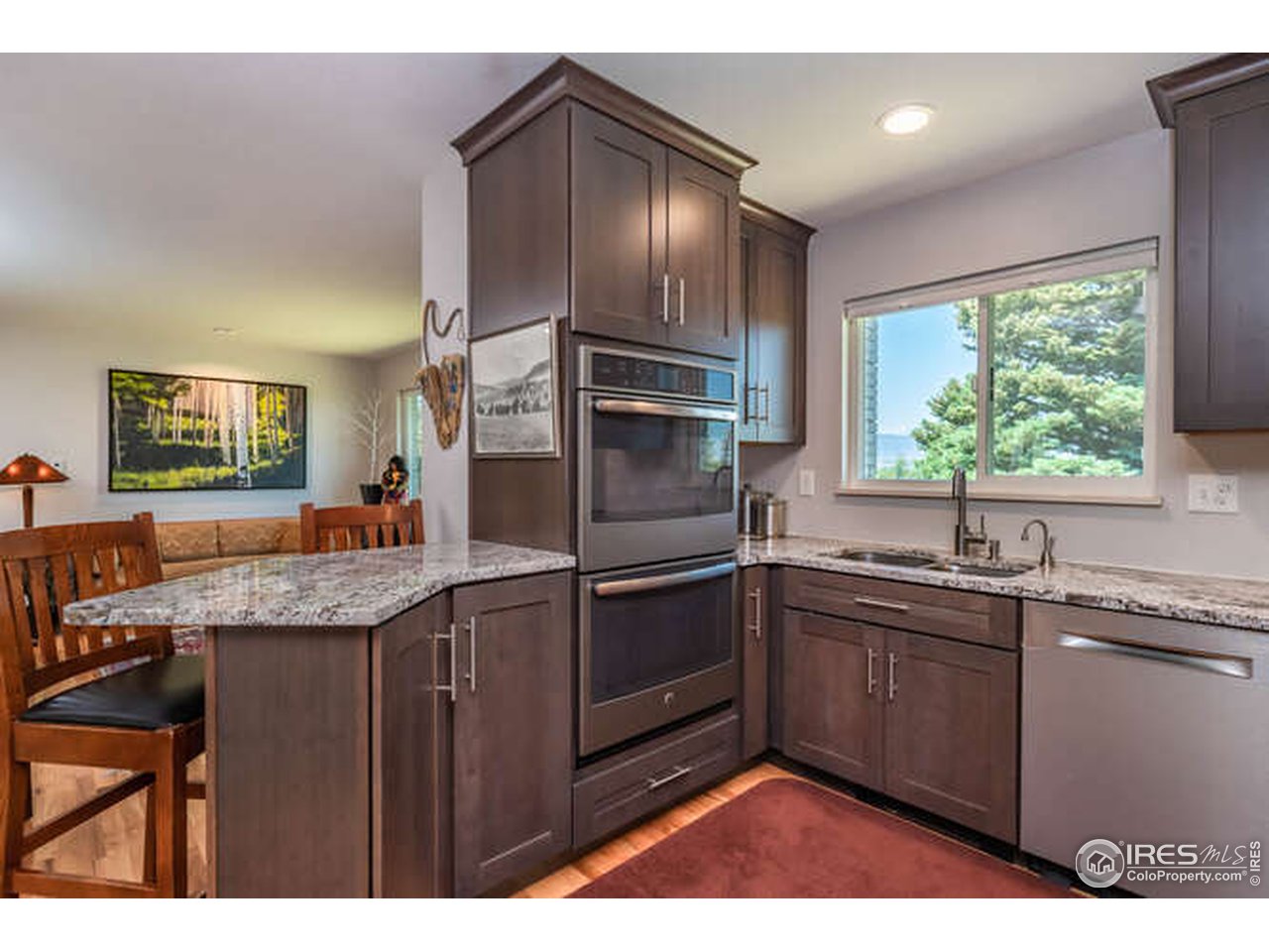 8829 Marathon Road Niwot, CO 80503 - Photo 4 of 33 Completely remodeled kitchen with mountain view while washing dishes