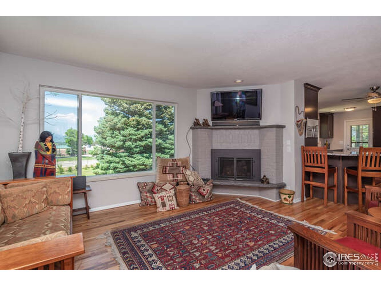 8829 Marathon Road Niwot, CO 80503 - Photo 7 of 33 The gas fireplace in this living room makes for the perfect place to enjoy your peaceful, Western exposure