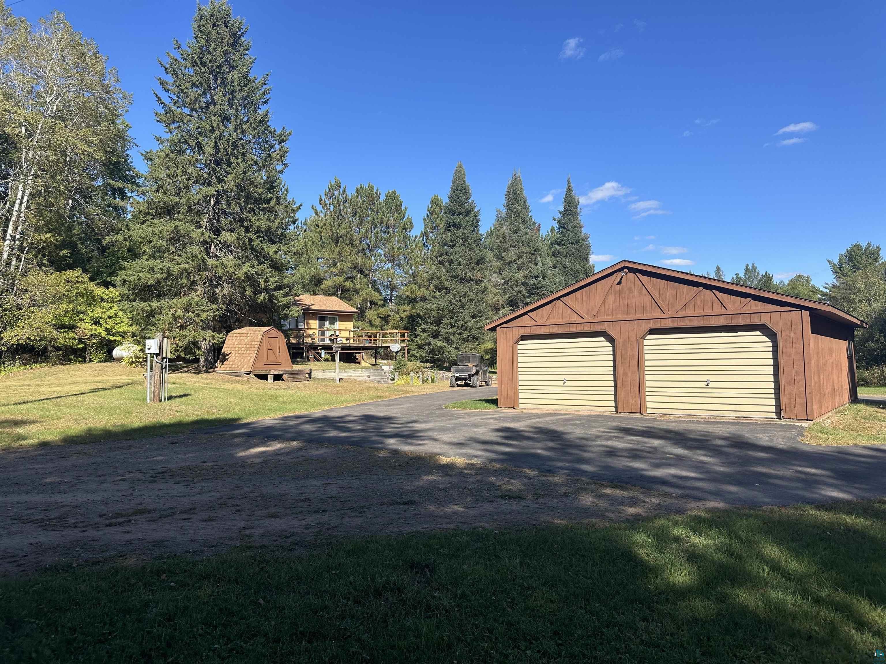 29020 Tulip Road Mellen, WI 54546 - Photo 2 of 12 Garage featuring a lawn