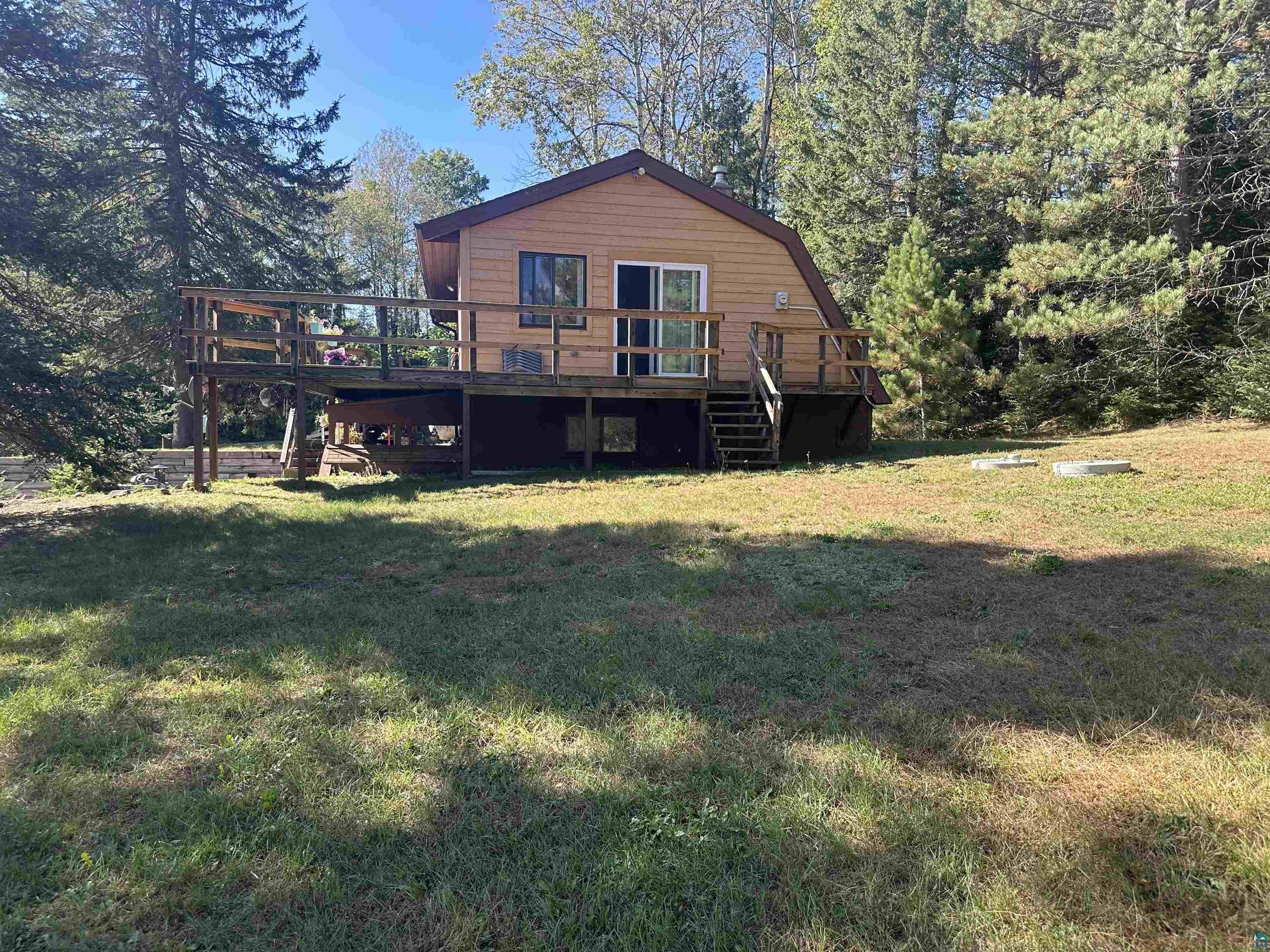 29020 Tulip Road Mellen, WI 54546 - Photo 6 of 12 Back of house with a lawn and a deck