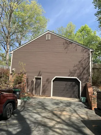 a front view of a house with parking space