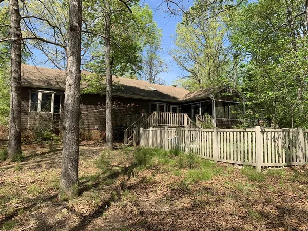 a view of a house with a small yard