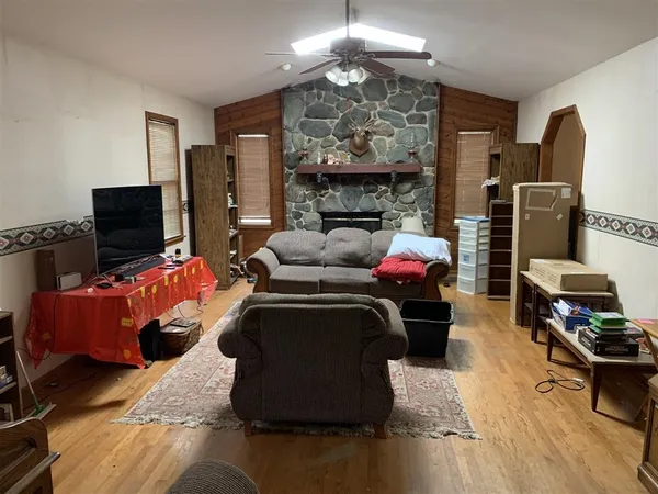 a living room with furniture fireplace and flat screen tv
