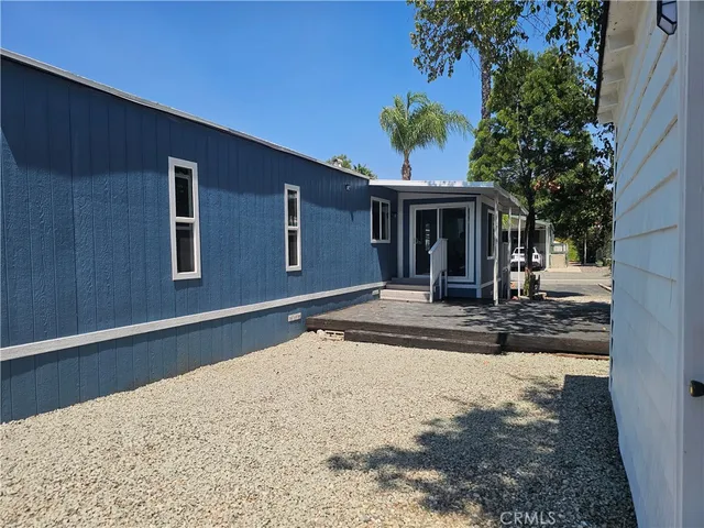 a view of a house with a backyard