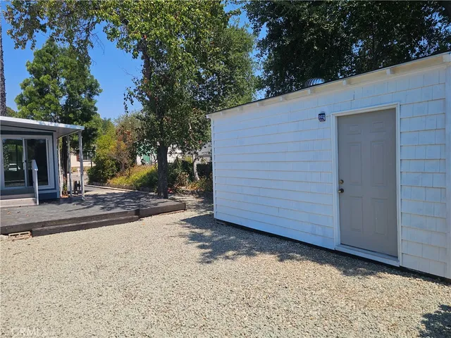 a view of a house with a backyard