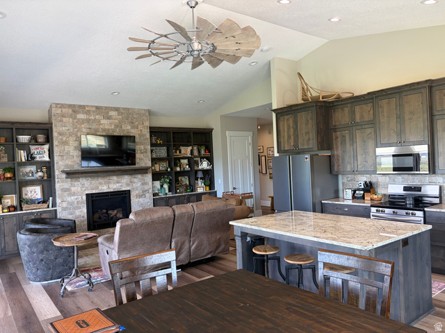 1325 South Round Road East Laketown, UT 84038 - Photo 11 of 40 Open-concept living space with vaulted ceilings