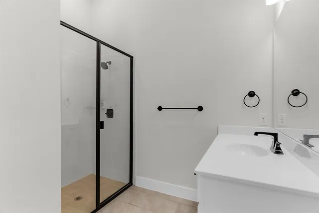 a bathroom with a sink and mirror