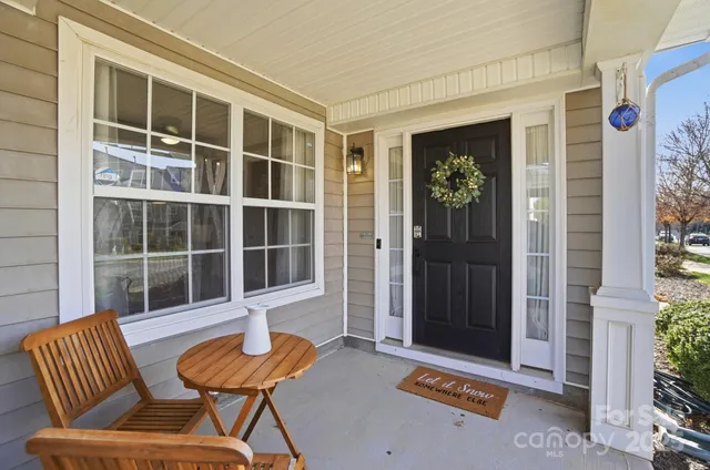 a front view of a house with outdoor seating