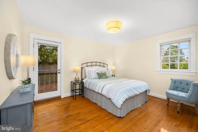 a spacious bedroom with a bed and a window