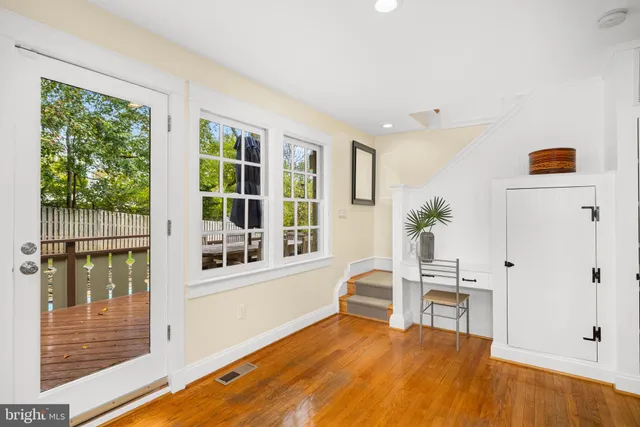 a view of a bedroom with furniture and windows