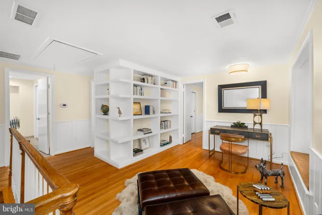 a bedroom with furniture and a flat screen tv