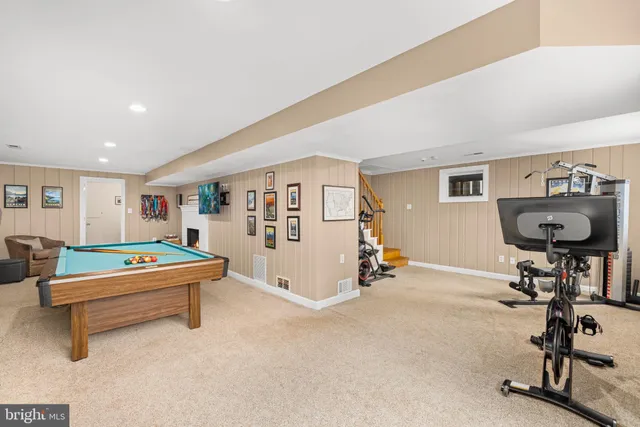 a living room with furniture and white walls