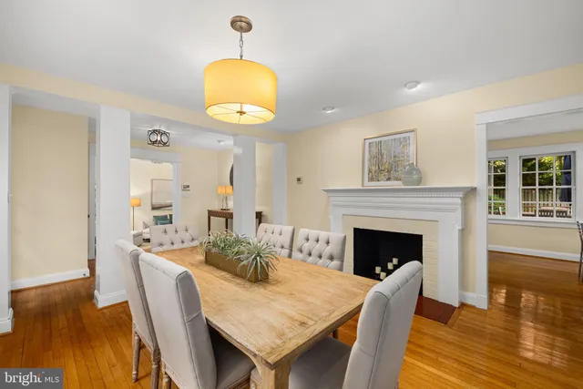 a view of a dining room with furniture wooden floor and chandelier