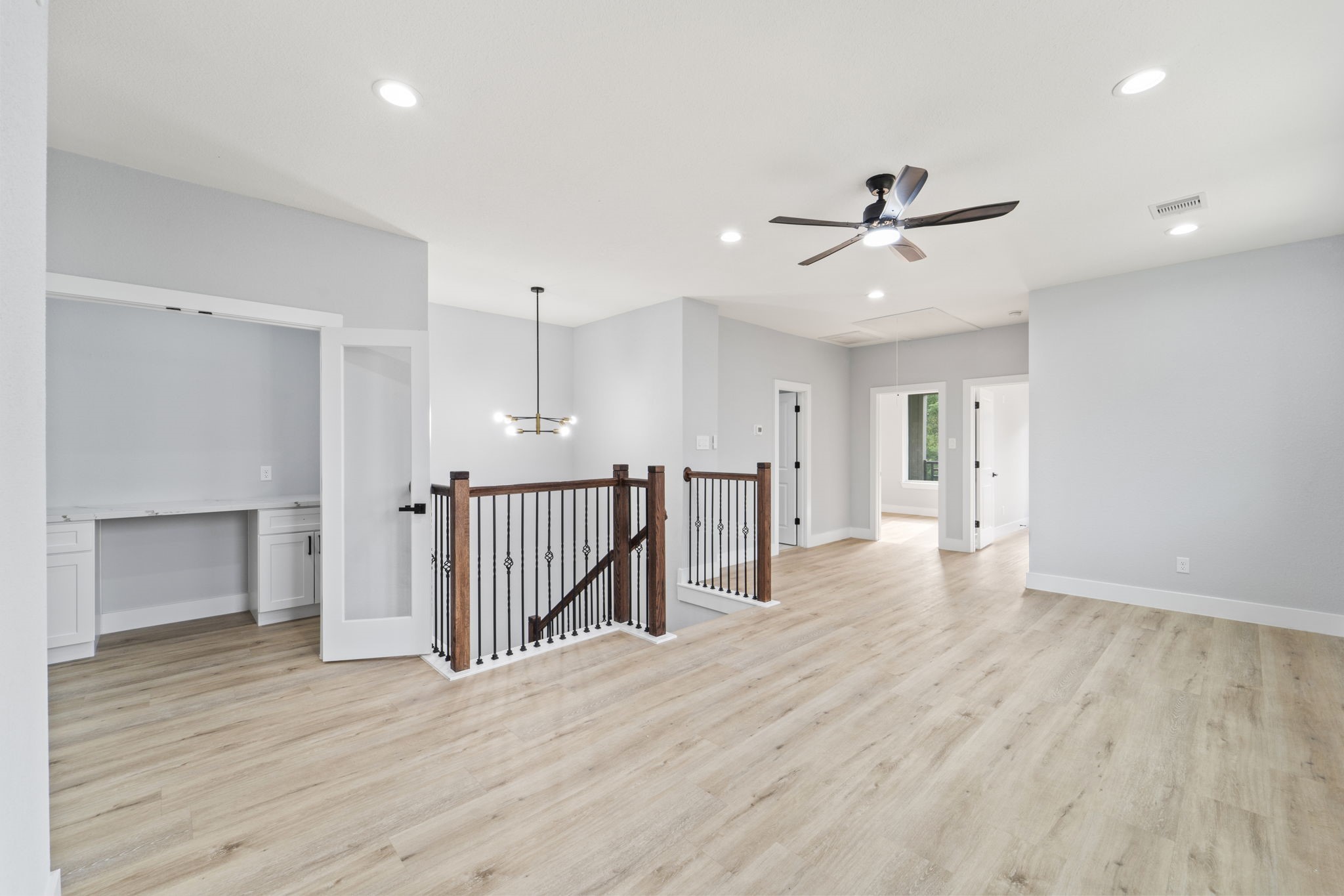 6631 Foster Street Houston, TX 77021 - Photo 12 of 31 a view of a room with wooden floor and ceiling fan