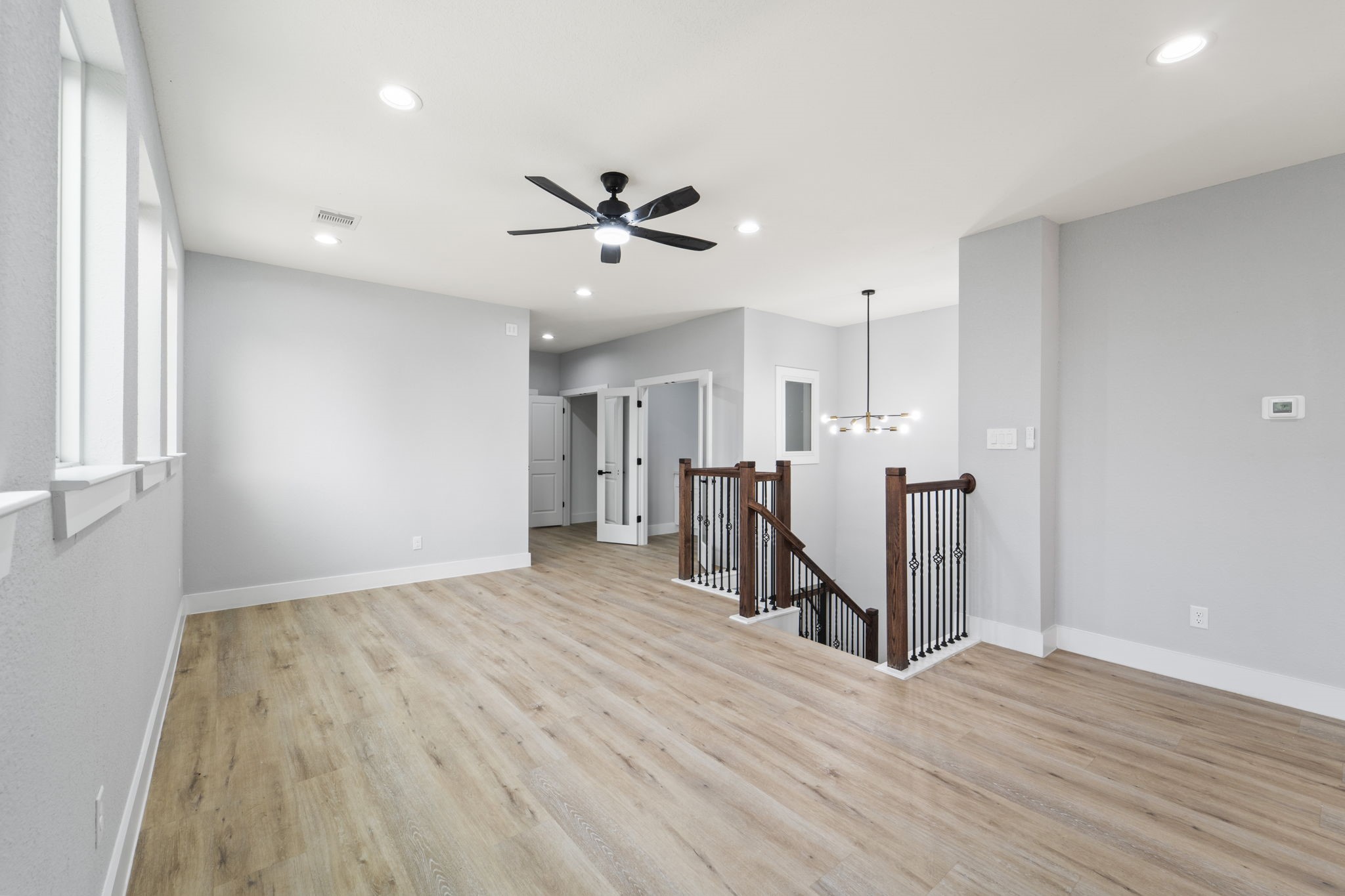 6631 Foster Street Houston, TX 77021 - Photo 13 of 31 a view of a kitchen with wooden floor and a ceiling fan