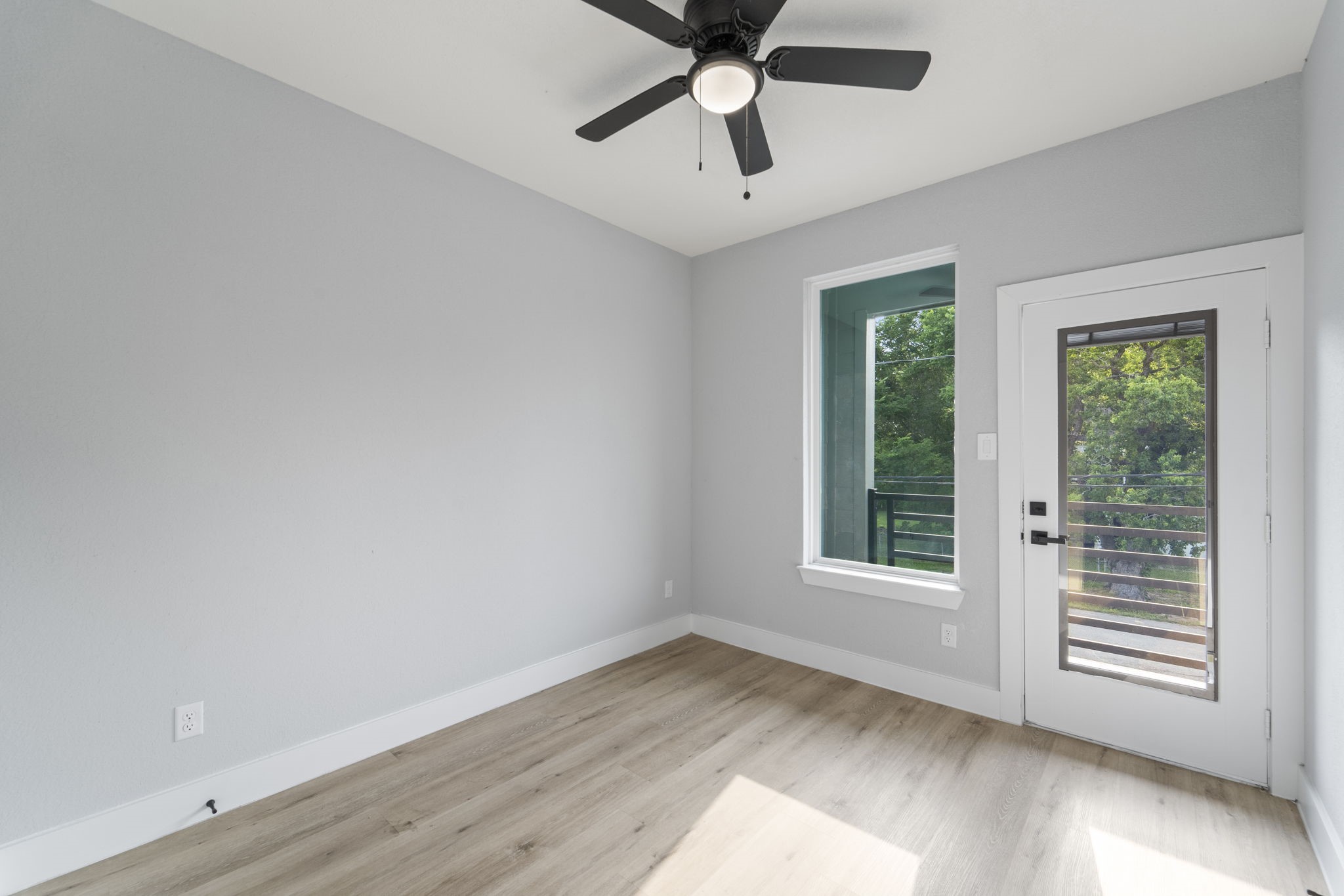 6631 Foster Street Houston, TX 77021 - Photo 15 of 31 a view of an empty room with a window and wooden floor