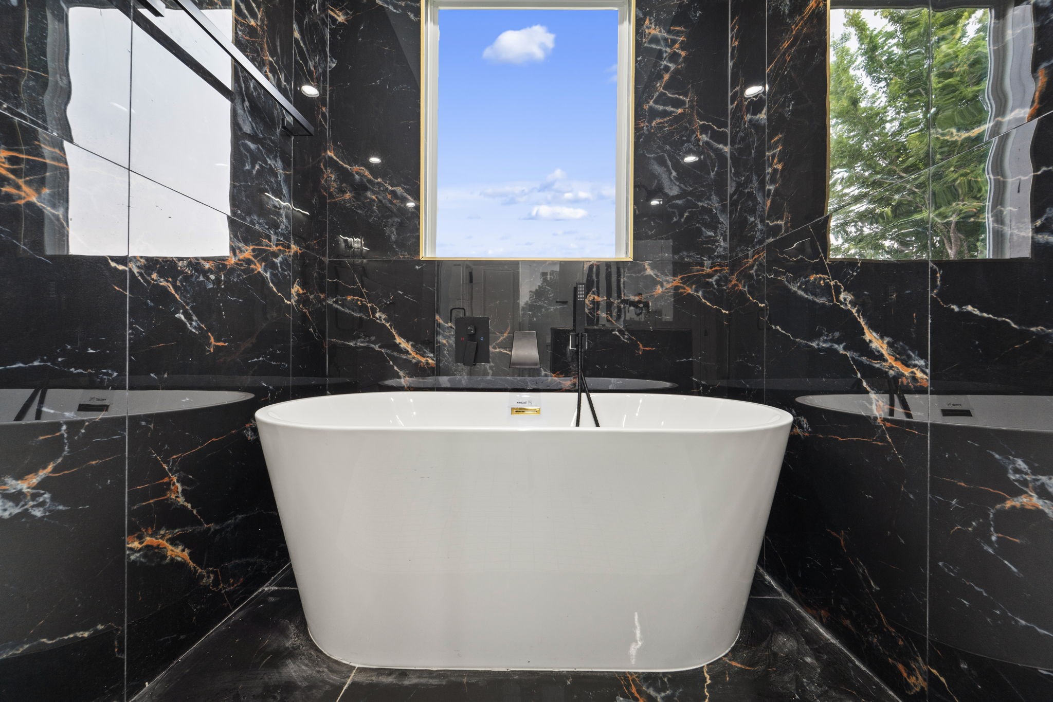 6631 Foster Street Houston, TX 77021 - Photo 24 of 31 a white bath tub sitting in a bathroom