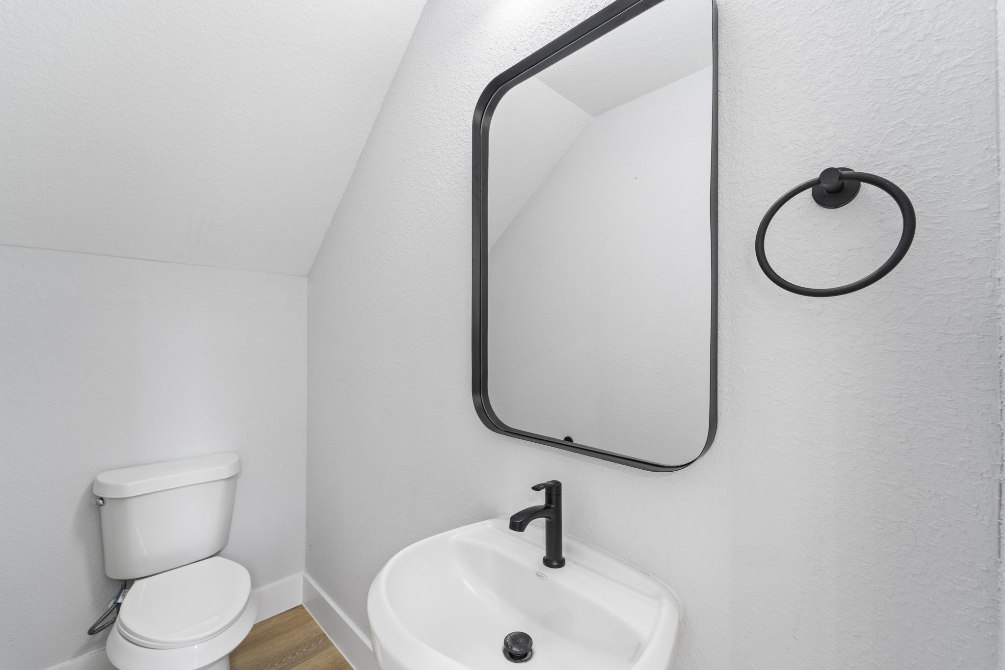 6631 Foster Street Houston, TX 77021 - Photo 10 of 31 a bathroom with a toilet sink and mirror