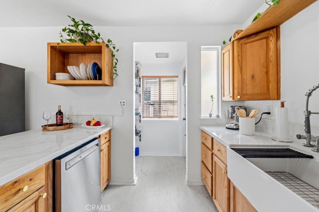 5055 North Raton Circle Long Beach, CA 90807 - Photo 5 of 42 a kitchen with a sink stove and cabinets
