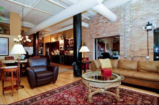 1000 West Washington Boulevard, Unit 406 Chicago, IL 60607 - Photo 2 of 8 a living room with furniture and a fireplace