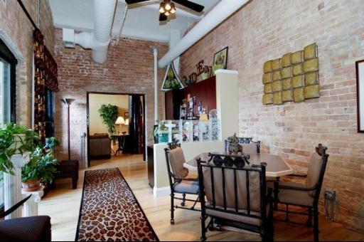 1000 West Washington Boulevard, Unit 406 Chicago, IL 60607 - Photo 5 of 8 a view of a livingroom with furniture and a potted plant