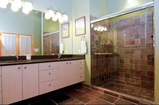 1000 West Washington Boulevard, Unit 406 Chicago, IL 60607 - Photo 7 of 8 a bathroom with a double vanity sink and a mirror
