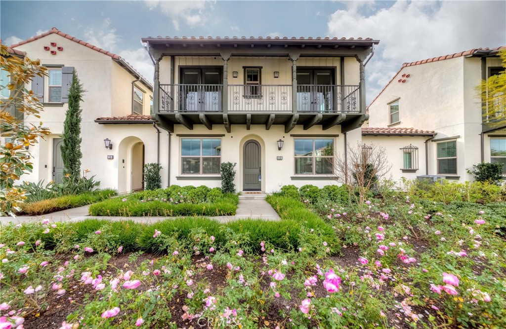 118 Walking Stick Irvine, CA 92618 - Photo 1 of 26 a front view of a house with garden