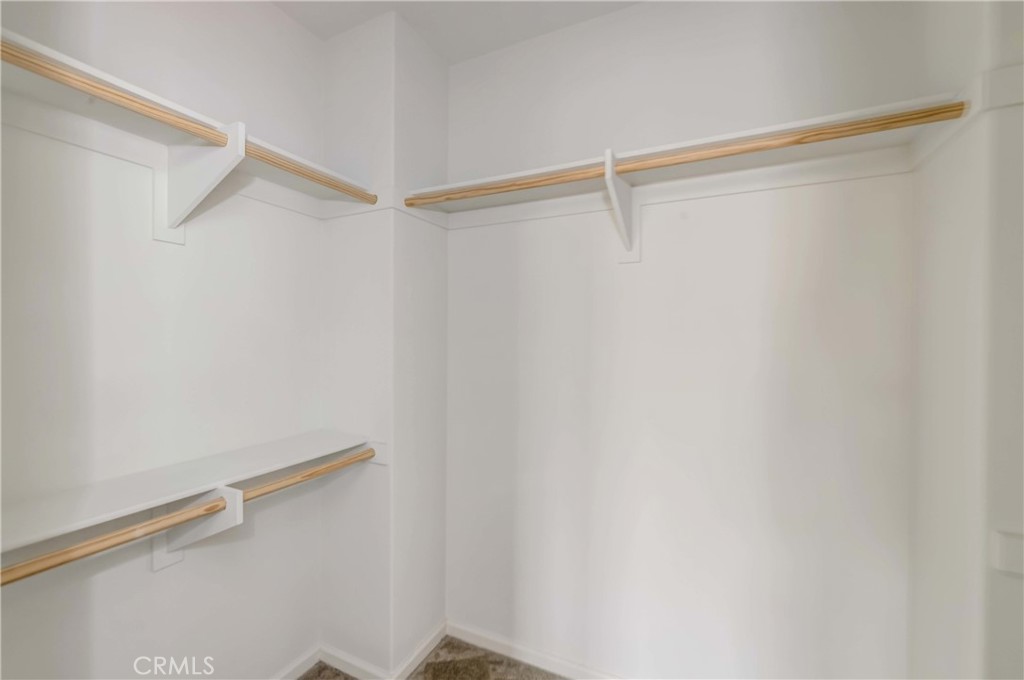 118 Walking Stick Irvine, CA 92618 - Photo 11 of 26 a view of a room with racks on the wall