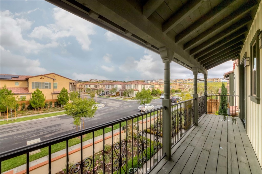 118 Walking Stick Irvine, CA 92618 - Photo 12 of 26 a view of a balcony with wooden floor