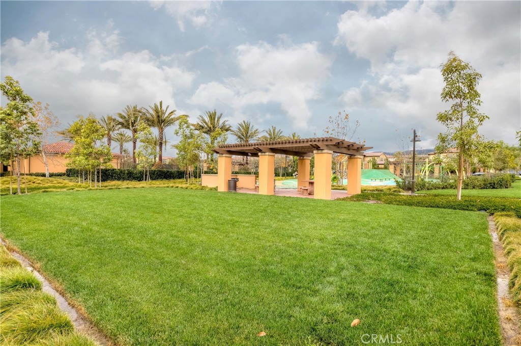 118 Walking Stick Irvine, CA 92618 - Photo 18 of 26 a view of a big yard with a large trees