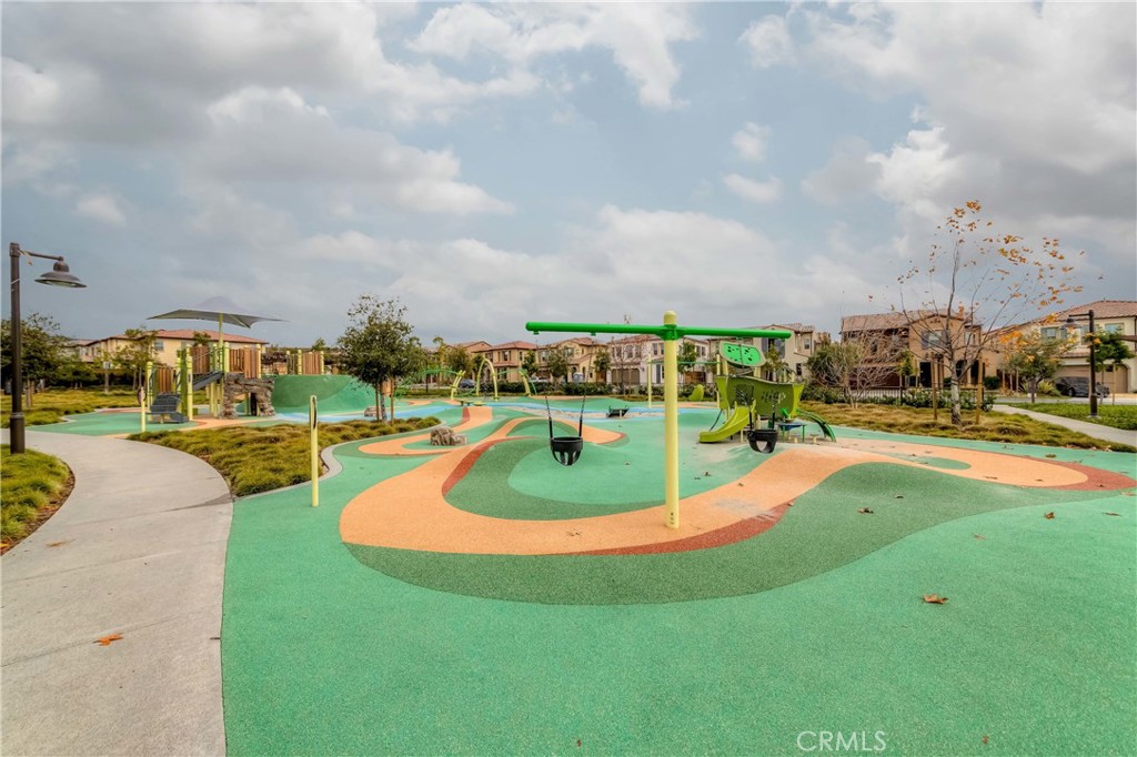 118 Walking Stick Irvine, CA 92618 - Photo 19 of 26 a view of a swimming pool with a yard