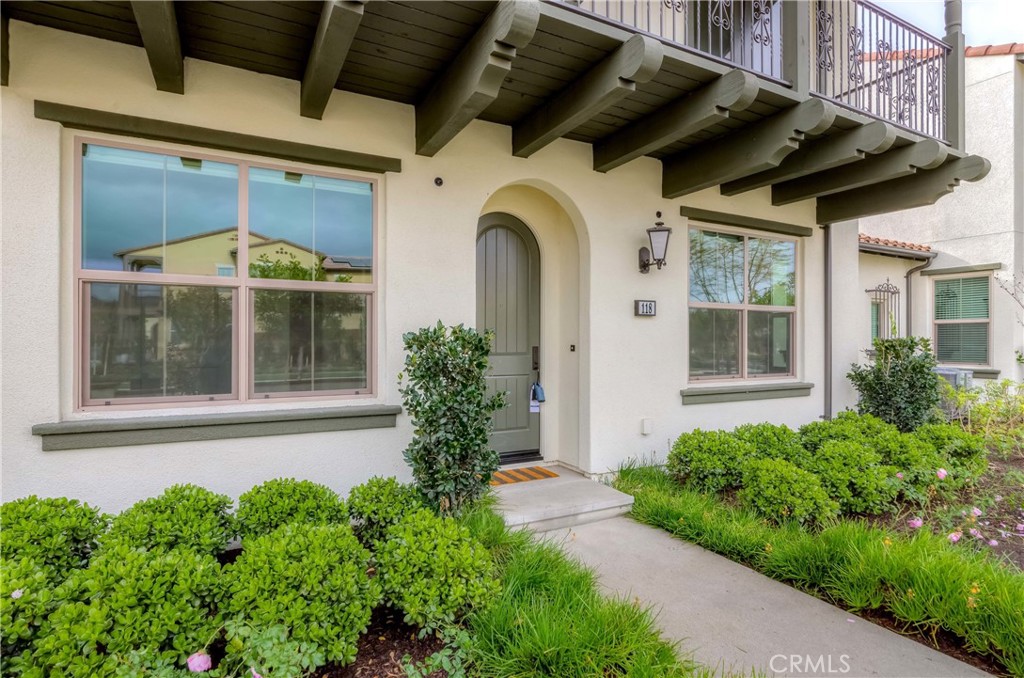 118 Walking Stick Irvine, CA 92618 - Photo 24 of 26 a front view of a house with garden