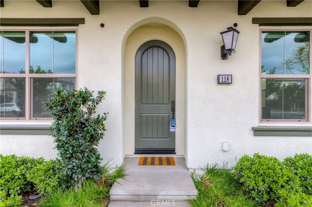 118 Walking Stick Irvine, CA 92618 - Photo 26 of 26 a front view of a house with a garden