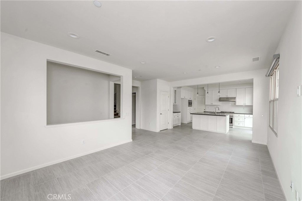 118 Walking Stick Irvine, CA 92618 - Photo 6 of 26 a view of kitchen with furniture and refrigerator