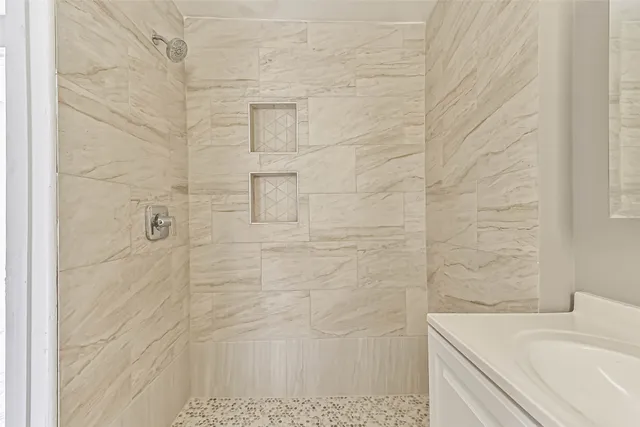 a bathroom with a sink and a shower