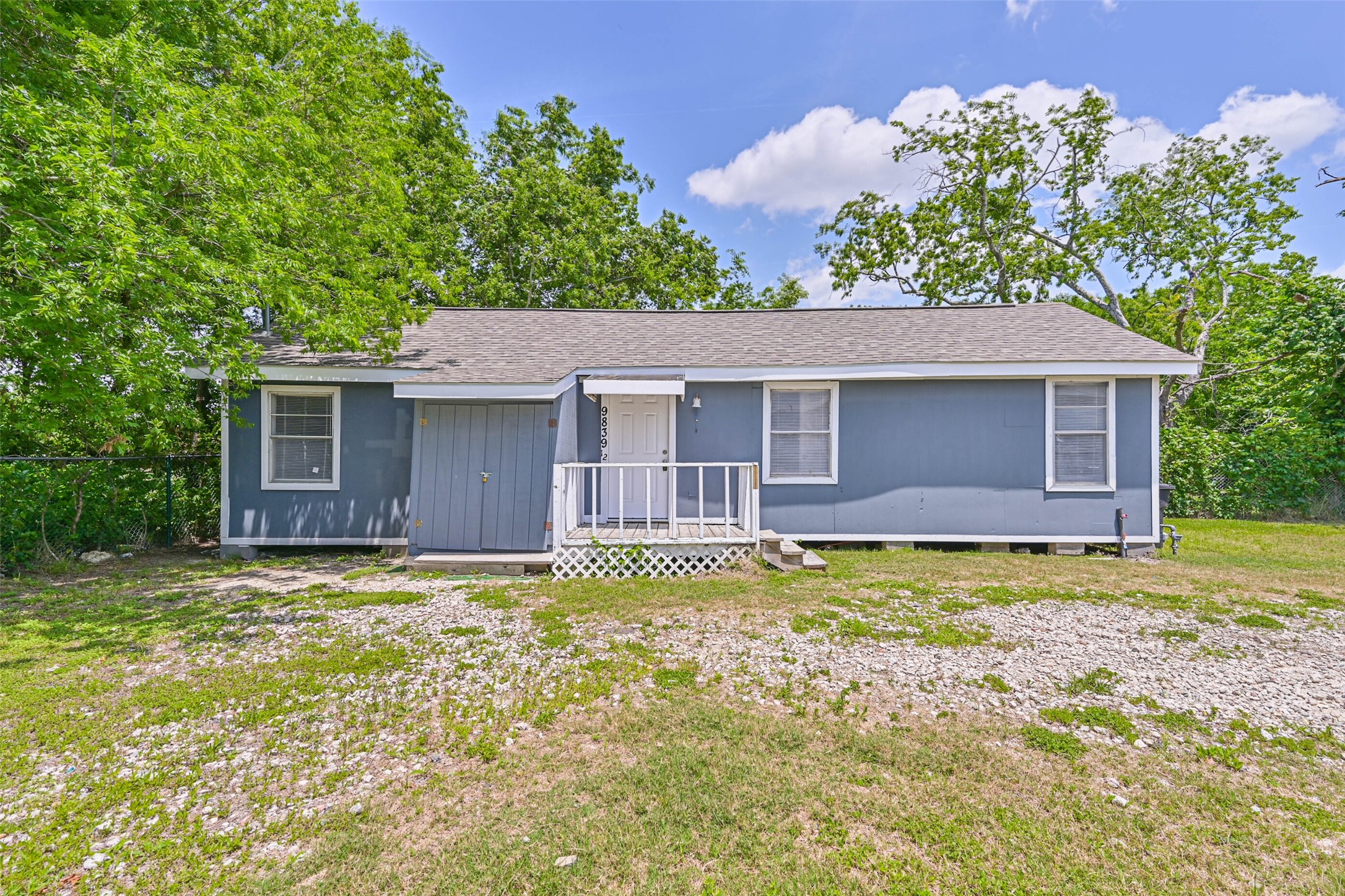 9839 Racine Street, Unit 1/2 Houston, TX 77029 - Photo 2 of 26 a house that has a big yard and large trees