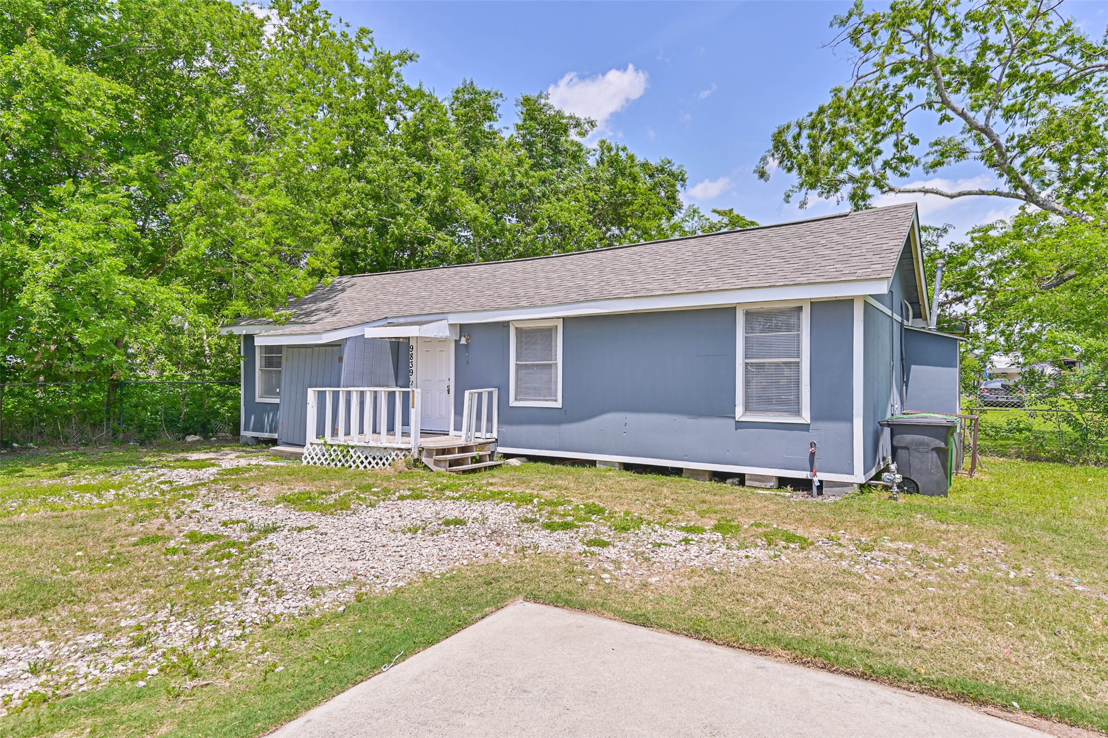 9839 Racine Street, Unit 1/2 Houston, TX 77029 - Photo 8 of 26 a view of a house with a yard